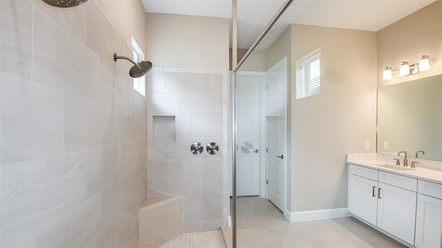 bathroom featuring vanity and a tile shower