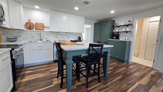 kitchen featuring white cabinetry, stainless steel appliances, and sink