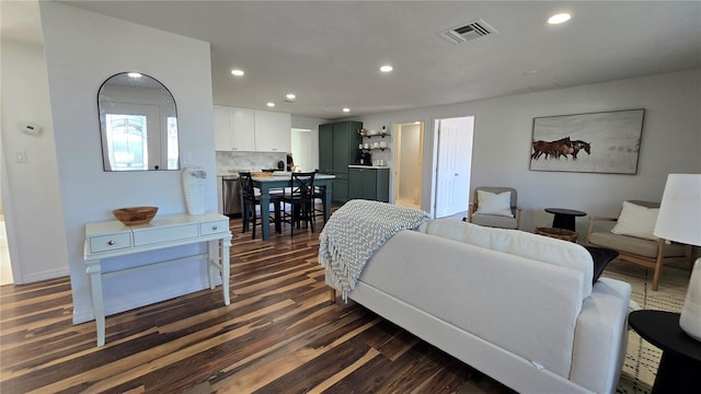 living room featuring dark hardwood / wood-style flooring