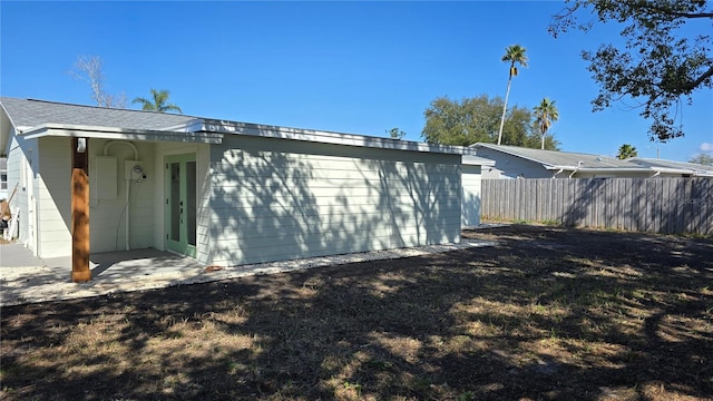 view of property exterior with a yard and a patio area