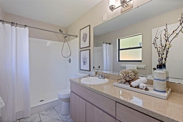 full bathroom with toilet, marble finish floor, vanity, and a tile shower