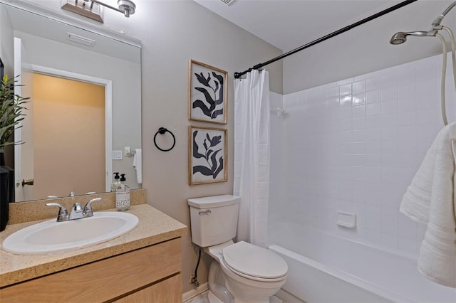 full bath with vanity, shower / tub combo, and toilet