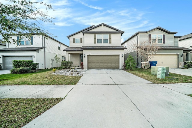 view of front of house with a garage and a front lawn