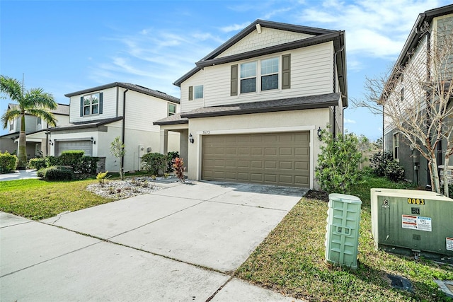 view of property with a garage and a front yard