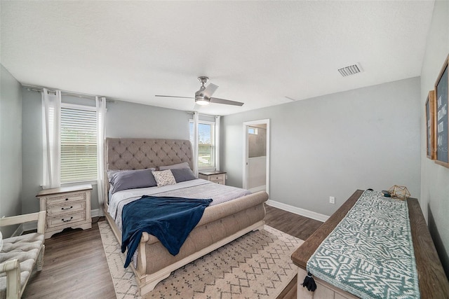 bedroom with ceiling fan and hardwood / wood-style floors