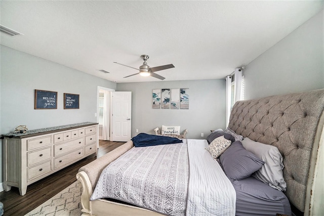 bedroom featuring dark wood-type flooring and ceiling fan