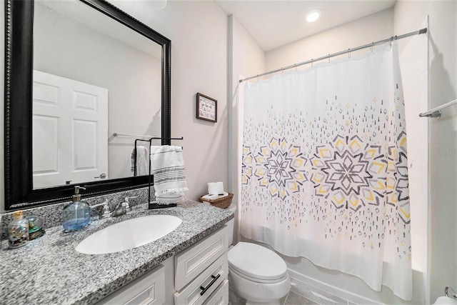 full bathroom featuring vanity, shower / tub combo with curtain, and toilet