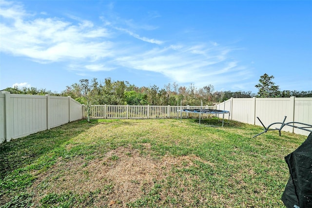 view of yard featuring a trampoline