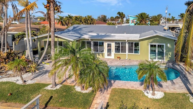 view of pool with a yard and a patio area