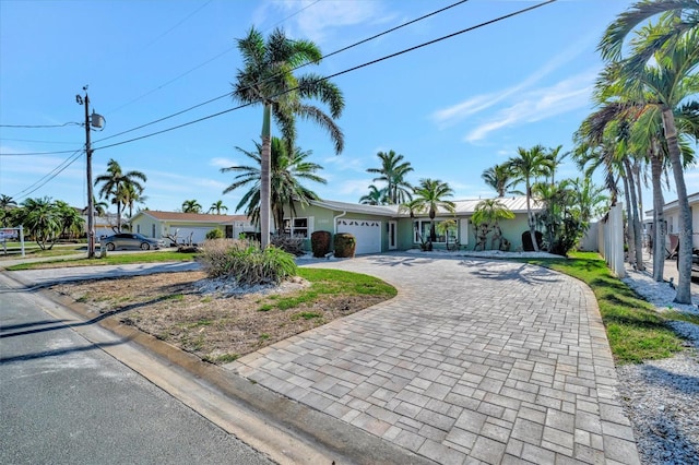 single story home with a garage