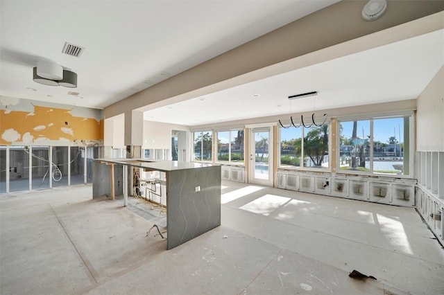 kitchen featuring a breakfast bar and decorative light fixtures