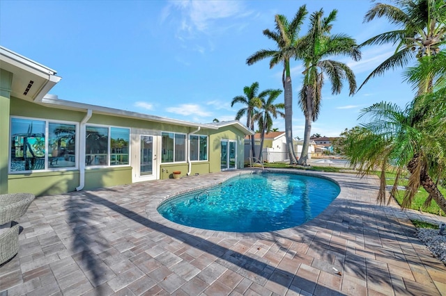 view of swimming pool with a patio