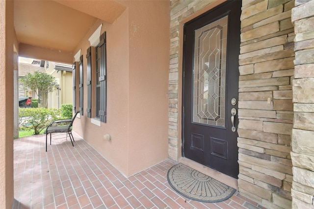 property entrance with covered porch