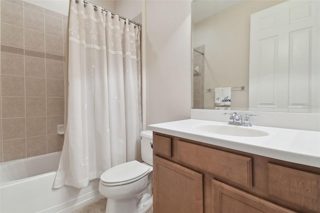 bathroom featuring toilet, vanity, and shower / tub combo with curtain