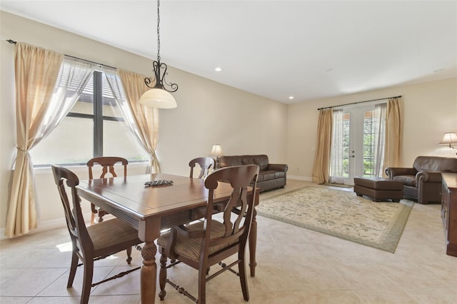 dining room with light tile patterned floors, baseboards, french doors, and recessed lighting