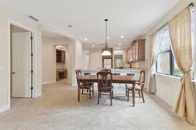 dining space with light tile patterned flooring, baseboards, visible vents, and recessed lighting