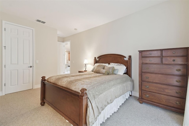 bedroom featuring light carpet, visible vents, and baseboards