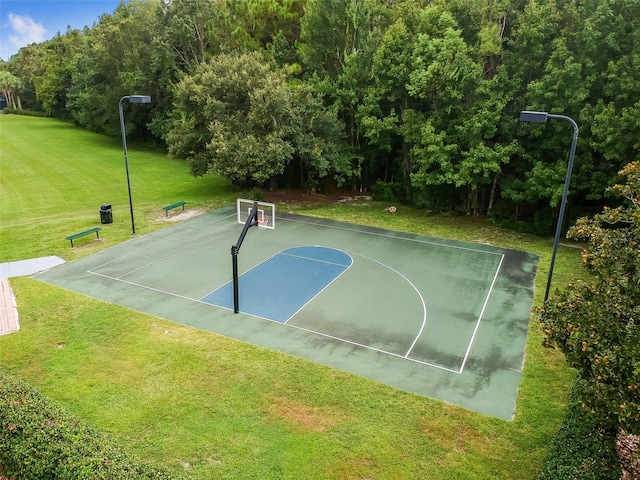 view of sport court featuring a yard and community basketball court