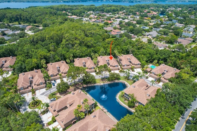 birds eye view of property with a water view