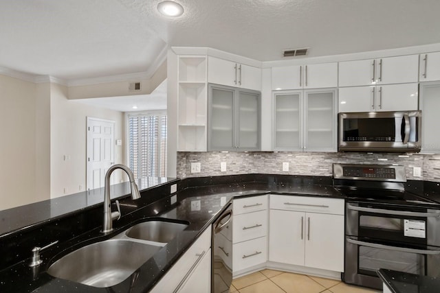 kitchen featuring white cabinetry, appliances with stainless steel finishes, and sink