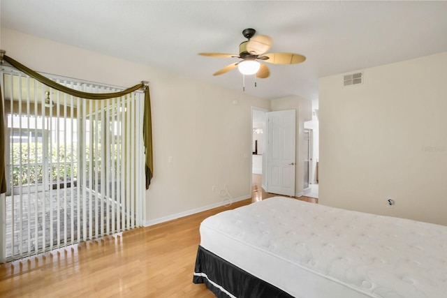 bedroom with wood-type flooring and ceiling fan