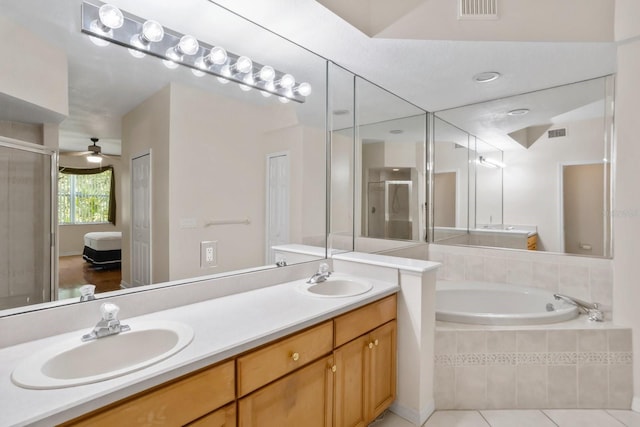 bathroom with tile patterned flooring, vanity, independent shower and bath, and ceiling fan