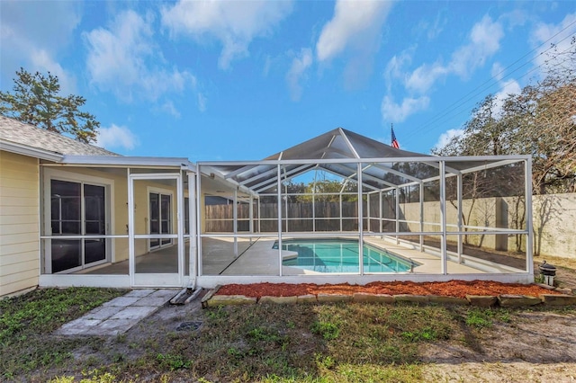 view of pool with a patio and a lanai