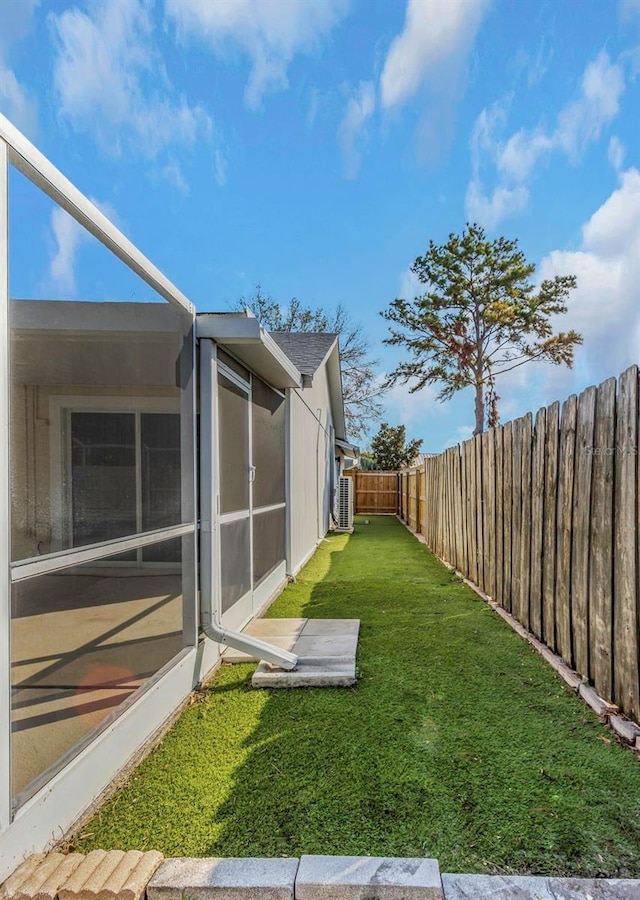 view of yard featuring a sunroom