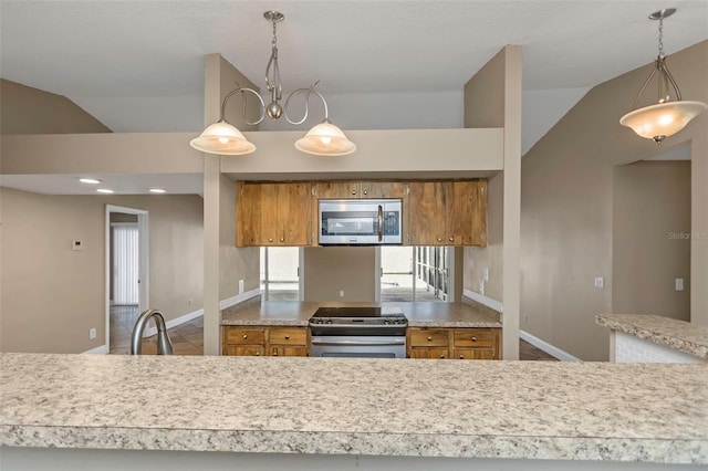 kitchen with lofted ceiling, sink, stainless steel appliances, a notable chandelier, and decorative light fixtures