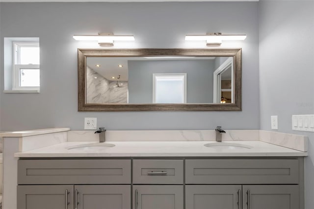 bathroom featuring vanity and a shower