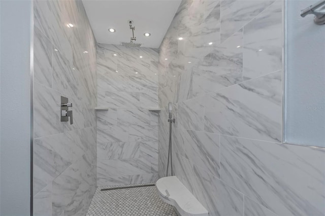 bathroom with a tile shower