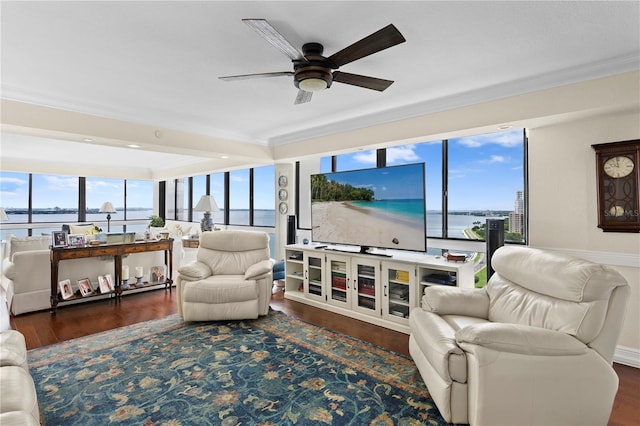 living room featuring a water view, dark hardwood / wood-style floors, and ceiling fan