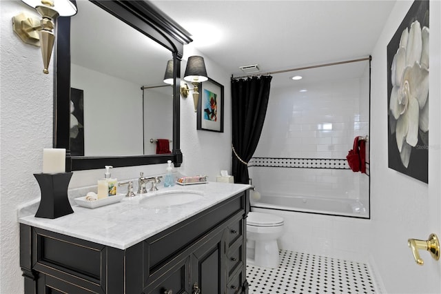 full bathroom with vanity, tile patterned flooring, shower / bath combination with curtain, and toilet