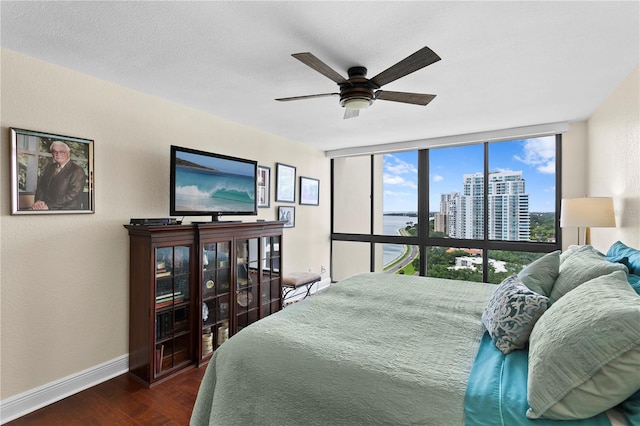 bedroom featuring dark hardwood / wood-style floors and ceiling fan