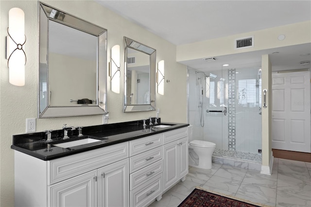 bathroom with vanity, an enclosed shower, and toilet