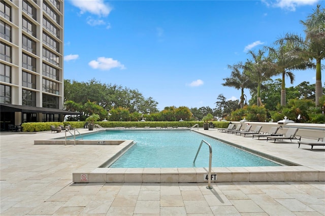 view of swimming pool with a patio area