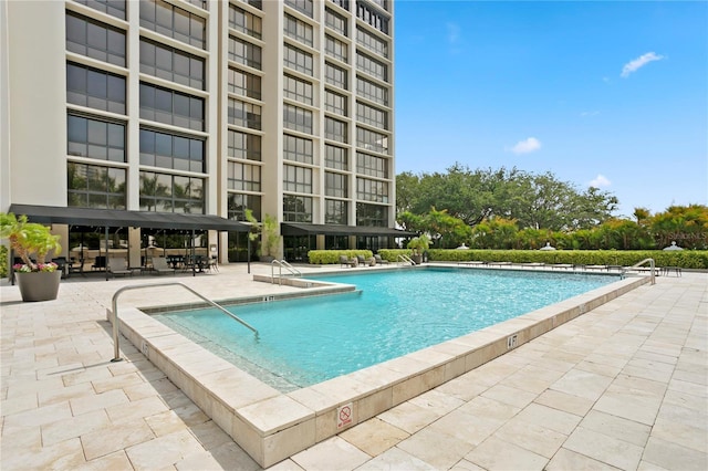 view of pool featuring a patio