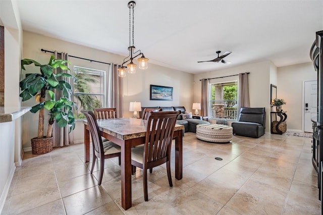 19308 Sunset Bay Dr, Land O Lakes, FL 34638 - dining room with a ceiling fan, baseboards, and light tile patterned floors