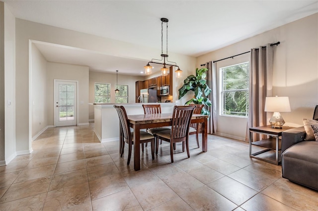 19308 Sunset Bay Dr, Land O Lakes, FL 34638 - dining room with baseboards and light tile patterned floors