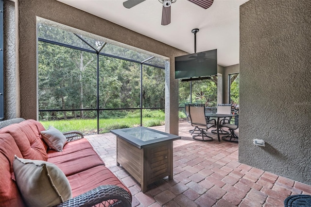 19308 Sunset Bay Dr, Land O Lakes, FL 34638 - view of patio / terrace featuring ceiling fan, outdoor dining space, a lanai, and an outdoor living space with a fire pit