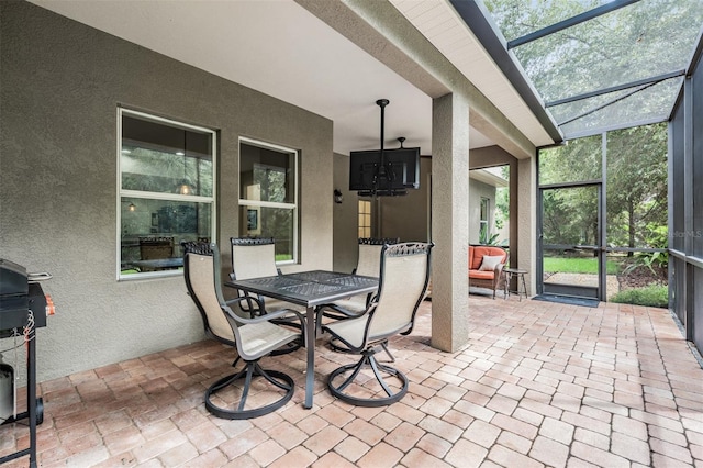 19308 Sunset Bay Dr, Land O Lakes, FL 34638 - view of patio / terrace featuring glass enclosure and outdoor dining area