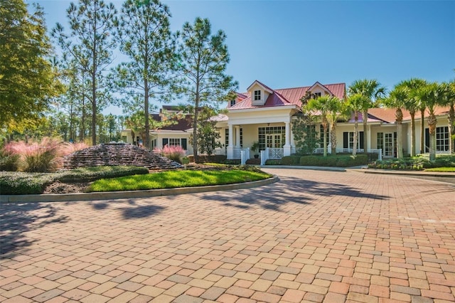 19308 Sunset Bay Dr, Land O Lakes, FL 34638 - view of front of home featuring metal roof and a porch