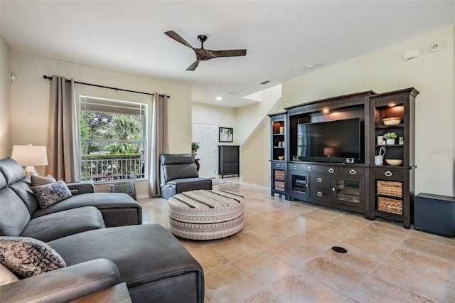 19308 Sunset Bay Dr, Land O Lakes, FL 34638 - living area featuring a ceiling fan, light tile patterned floors, and baseboards