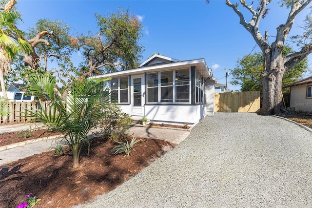 view of front of property featuring a sunroom