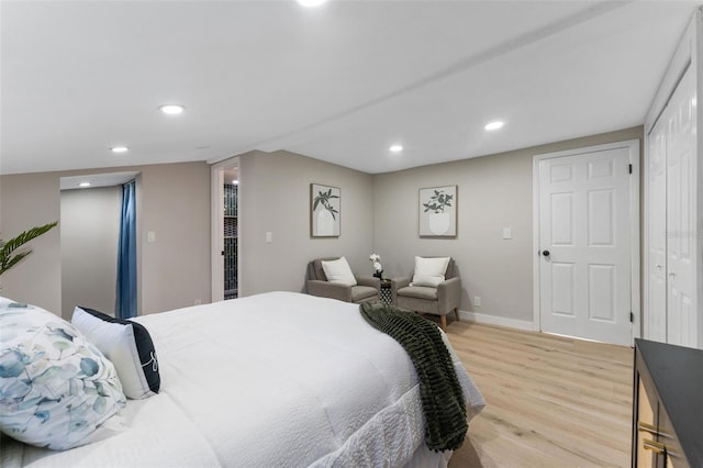 bedroom with a closet and light hardwood / wood-style flooring