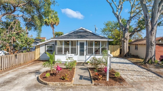 view of front of home with a sunroom