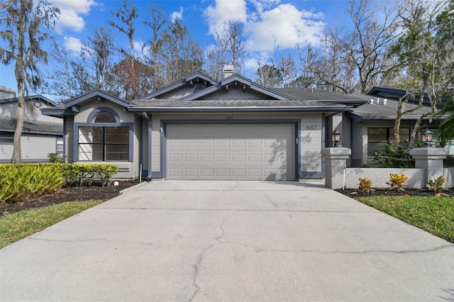 ranch-style home featuring a garage