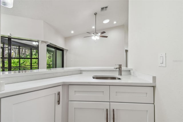 bathroom with sink, vaulted ceiling, and ceiling fan