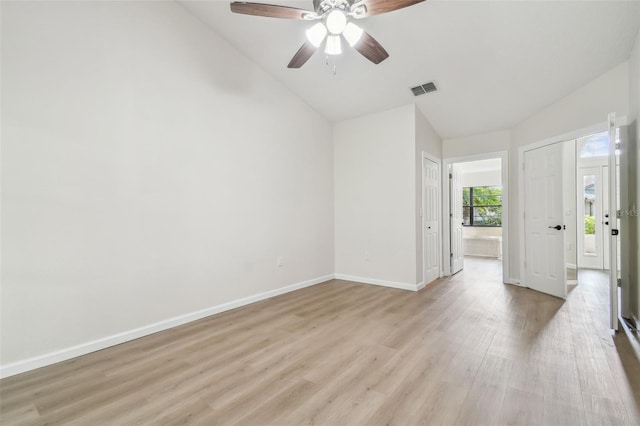 unfurnished room featuring ceiling fan, lofted ceiling, and light wood-type flooring