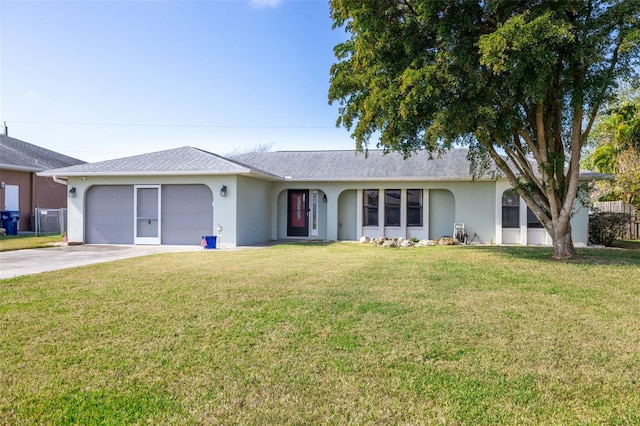 single story home featuring a garage and a front yard